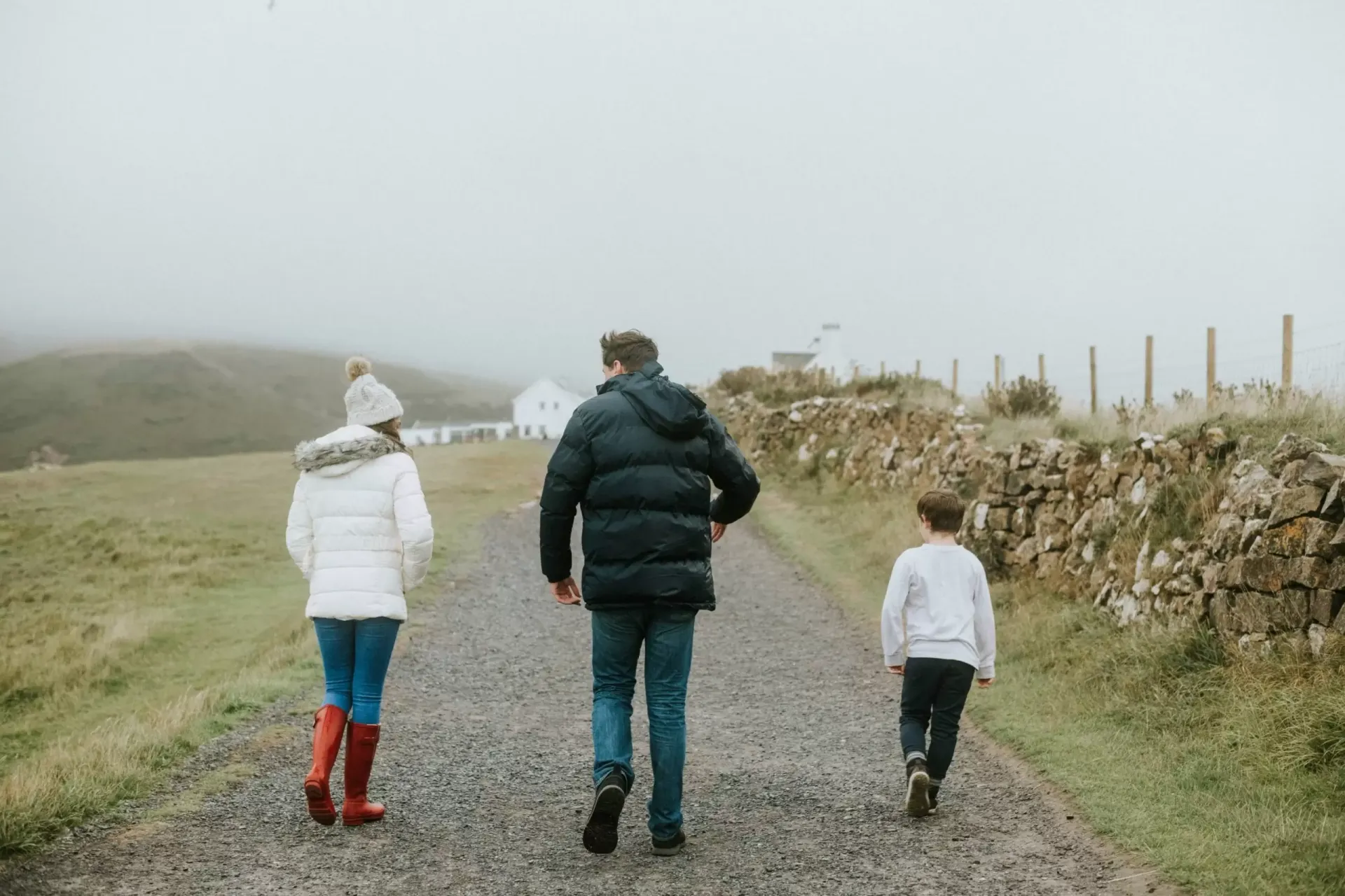 A family walking together on a country path